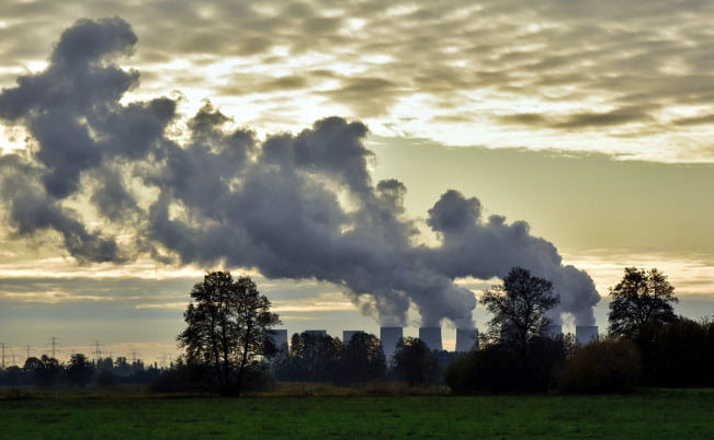 Photo of a power station and a field.