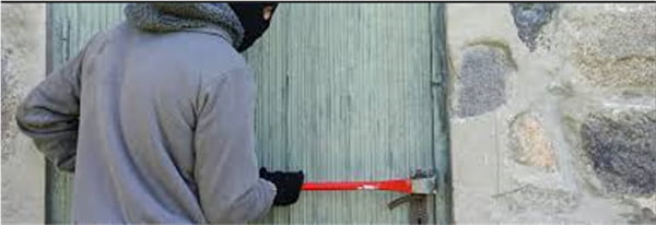 Man breaking into a shed