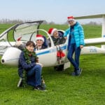 Child and Adults with a glider at Southdown Glider Club