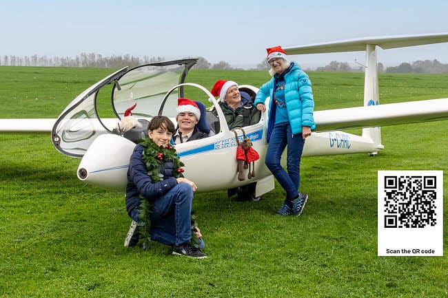 Child and Adults with a glider at Southdown Glider Club
