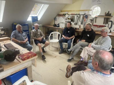 Visitors to Pulborough Shed drinking coffee.