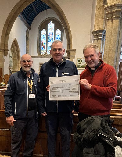 Storrington & Sullington Wardens at St Mary's Church receiving the donation from Revd. Jonathan Swindells