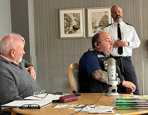 policemen speaking at forum