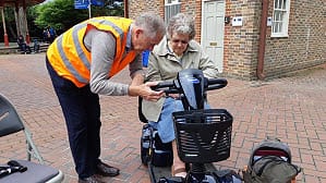 Instruction of person on mobility scooter