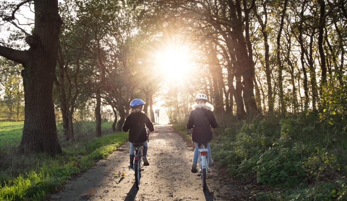 Two girls on bikes photo