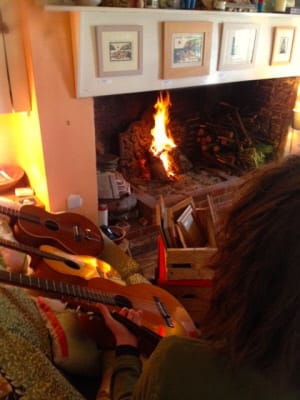 Fireplace with guitar and violin
